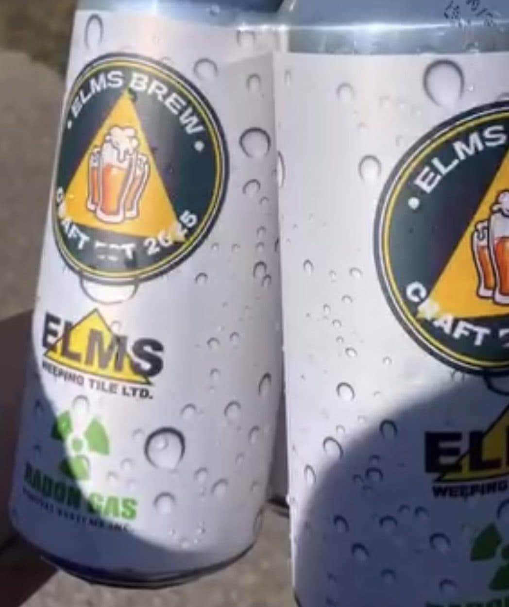 Elms-branded craft beer cans on ice at the charity golf tournament.